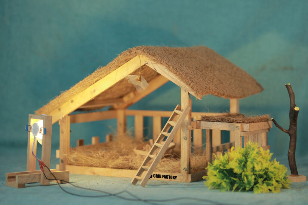 Crib set with shrubs and tree and spot light